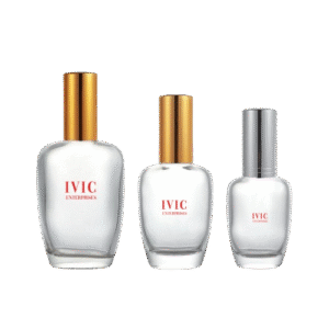 Three clear glass perfume bottles with gold and silver caps of ivic enterprises