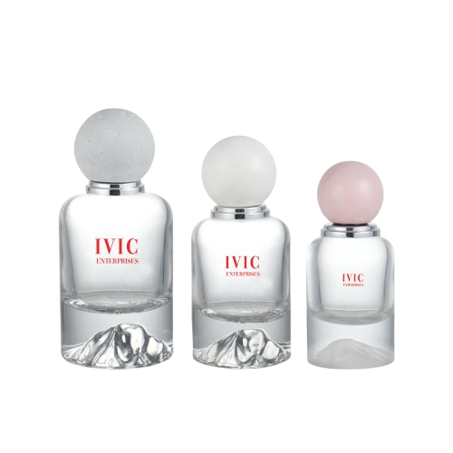 Three clear glass perfume bottles with round frosted caps, each in different sizes of ivic enterprises