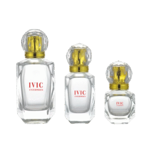 Three clear perfume bottles of varying sizes with gold and crystal-like round caps of ivic enterprises