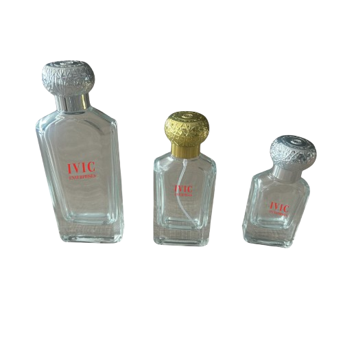 Three clear glass perfume bottles of varying sizes with metallic caps of ivic enterprises